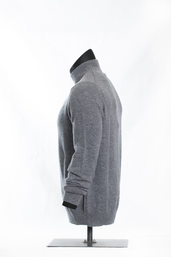 Side view of heather grey roll-neck sweater on a black mannequin