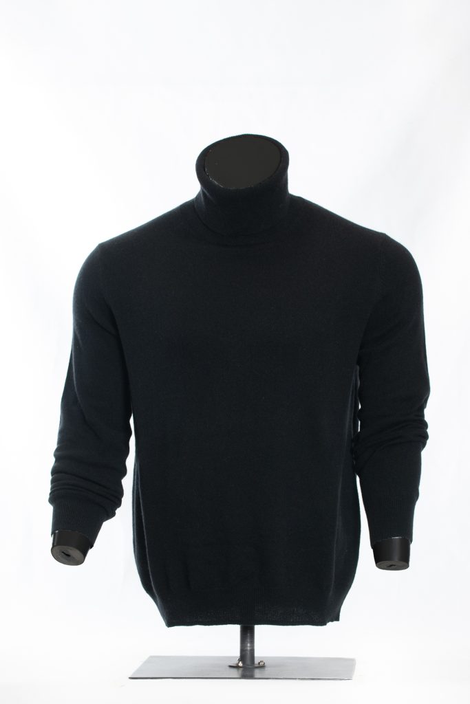 Back view of midnight black roll-neck sweater on a black mannequin