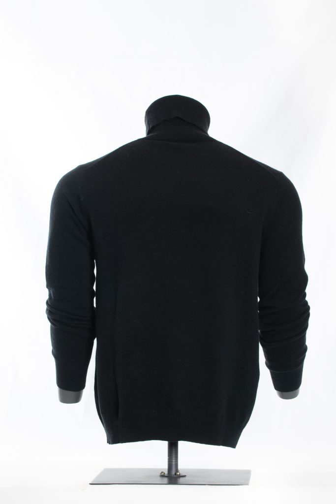 Side view of midnight black roll-neck sweater on a black mannequin